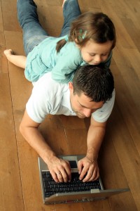 Father and daughter on computer