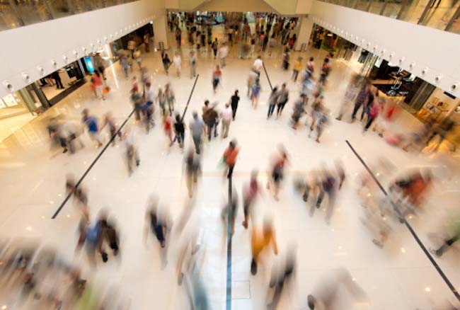 People walking through a shopping mall.