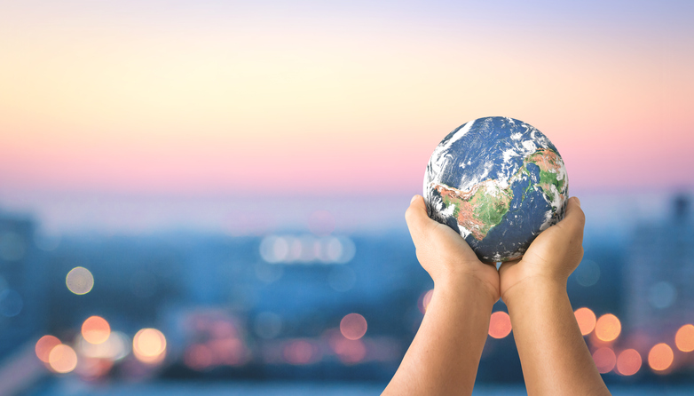 Hands holding globe - environmental concept
