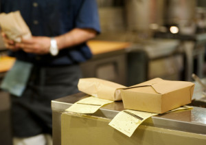 waiter prepares takeout