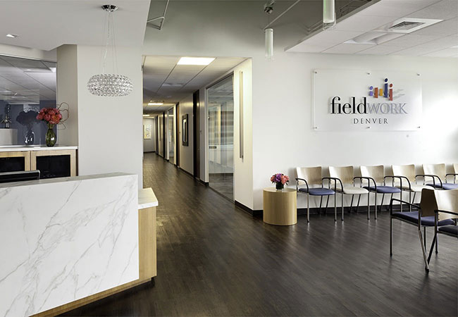 Room with front desk and chairs, Fieldwork Denver location
