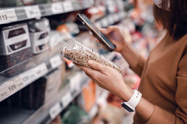 ethical consumer reading brand label
