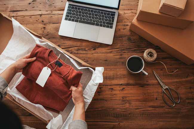 A person is wrapping up a package