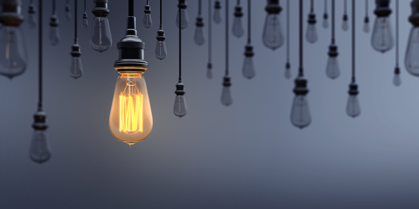 light bulb glowing, standing out