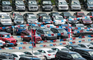 A car dealership featuring a wide variety of vehicles ranging from compact sedans to full size pickup trucks.