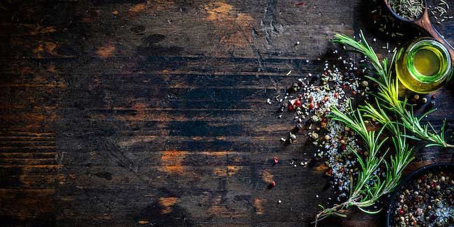 Herbs and spices on a board.