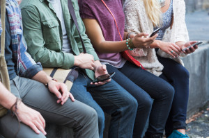Young adults with mobile phones